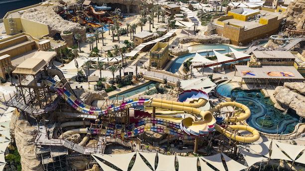 Wave pool and leisure attractions at Aquarabia water park creating a relaxing aquatic experience
